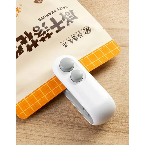 Hnventis 2-in-1 rechargeable mini bag sealer with cutter for sealing plastic food storage bags, portable thermal sealer machine.